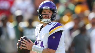 Sam Darnold #14 of the Minnesota Vikings drops back to pass ahead of the Jets vs Vikings London NFL game