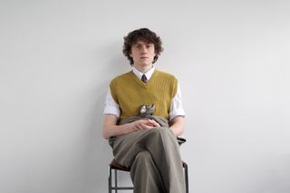 Utilitarian and Workwear-inspired S/S 2024 Men’s Fashion photographed against white wall