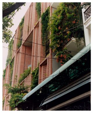 Tropical Space’s Premier Office, in Tan Binh, is a bioclimatic, seven-floor building featuring perforated brick walls