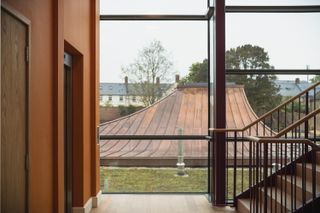 views of the sherborne in dorset with historical facade and modern rooftop addition