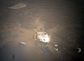 The backshell and parachute that helped NASA's Perseverance Mars rover and Ingenuity helicopter land on the Red Planet in February 2021, as photographed by Ingenuity on April 19, 2022.