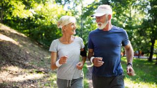 two happy people running