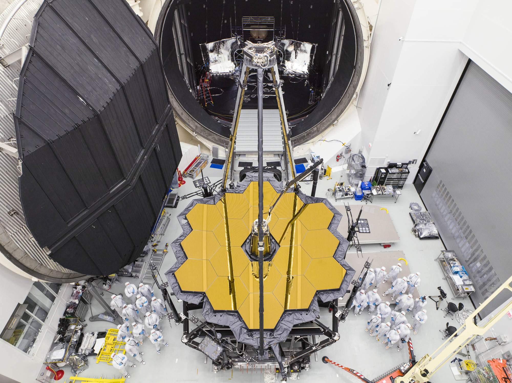 NASA engineers pose with the James Webb Space Telescope shortly after its emergence from Chamber A, a giant vacuum testing chamber at the Johnson Space Center in Houston, on Dec. 1, 2017.