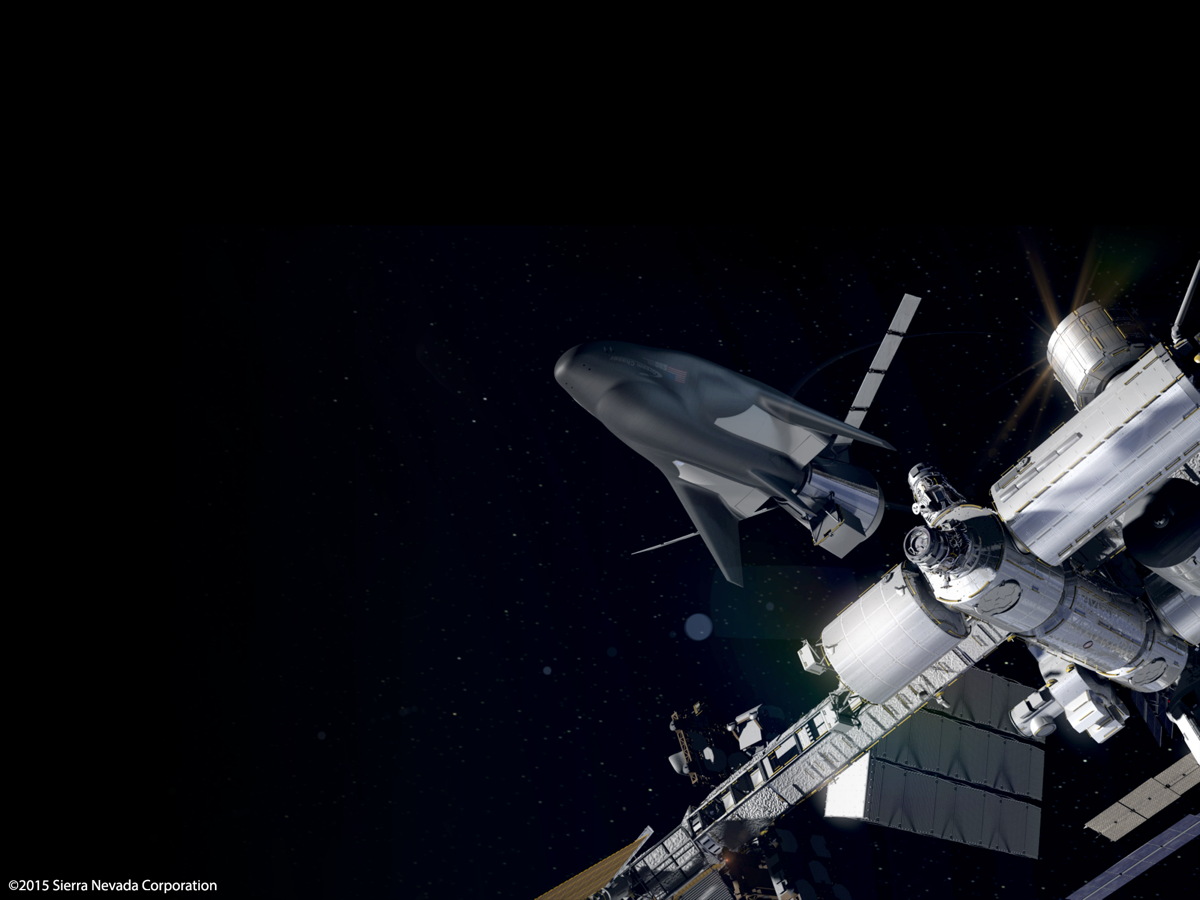 Artist&#039;s concept showing Sierra Nevada&#039;s unmanned Dream Chaser Cargo System docking to the International Space Station.