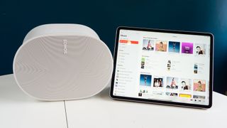 Sonos Era 300 on white table with iPad next to it