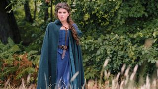 Lady Jane Grey (Emily Bader) in a blue robe and cloak in Prime Video&#039;s &quot;My Lady Jane&quot;