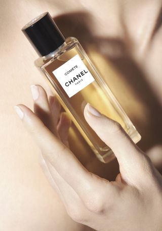 Chanel Comète eau de parfum held in a hand