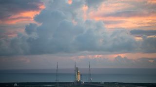 photo of rocket at dawn