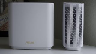Asus ZenWiFi ET8 front and side views on table