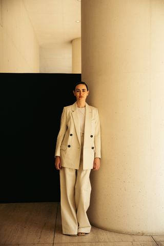 portrait of frida escobedo wearing white loose suit