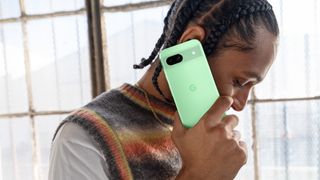 A person holding an Aloe Google Pixel 8a