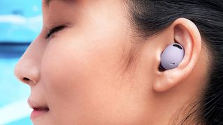 A woman wearing the Samsung Galaxy Buds 2 Pro earbuds