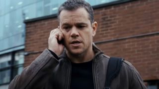 Matt Damon taking a tense phone call outside in Jason Bourne.