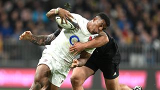 Immanuel Feyi-Waboso of England is tackled during the International Test Match between New Zealand All Blacks and England ahead of the Zealand vs England live stream: Summer Internationals 2024 2nd Test
