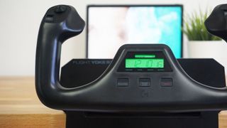 Logitech G Flight Yoke mounted to a wooden desk