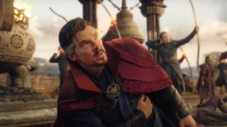 Benedict Cumberbatch looking pained while fighting off the Scarlet Witch in Doctor Strange in the Multiverse of Madness.