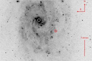 A Hubble telescope image shows a red circle that could be an ejected black hole in a distant galaxy.