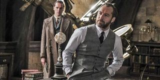 Fantastic Beasts: The Crimes of Dumbledore Professor Dumbledore sits cockily on the edge of his desk