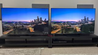 Samsung Qn85D and HIsense U7N with dusk city landscape on screen