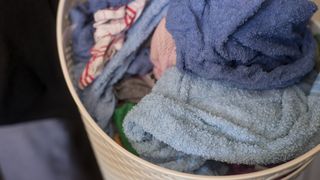 wet towels piled high in a laundry basket