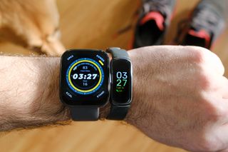 Fitbit Inspire 3 on the same wrist as an Amazfit Bip 5.