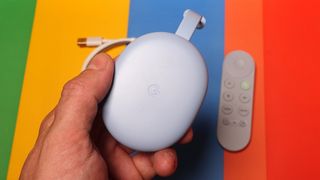 Chromecast with Google TV in a hand