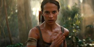 Alicia Vikander's Lara Croft running in the jungle in Tomb Raider