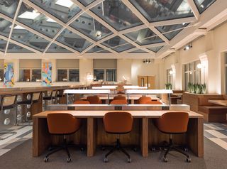 deskspace under glass roof at WeWork - 37 Av. Trudaine - Paris