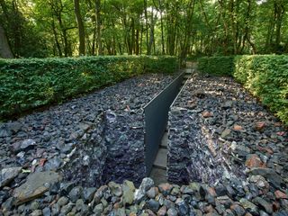 Anya Gallaccio, The Light Pours Out of Me, 2012, a subterranean grotto lined with dazzling purple amethysts, inspired the processing of the water through an amethyst vortex