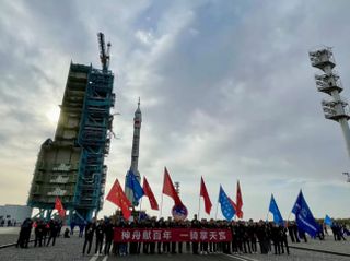 The Long March 2F to launch Shenzhou 13 crew spacecraft being vertically transferred to the pad at Jiuquan, Oc. 7, 2021.