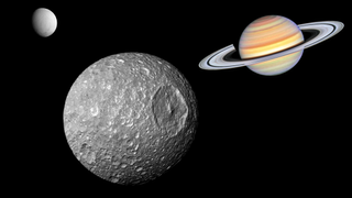 An illustration shows Saturn&#039;s moon Mimas with the gas giant and Enceladus in the background.