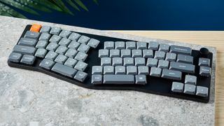 A Keychron K11 Max wireless ergonomic keyboard with a 65% Alice layout