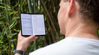 Reading a book on the Google Pixel Fold's large inner display