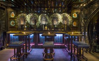 Bar with lighting and table with chairs