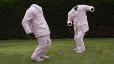 Two dancing pink suits, Erwin Wurm artwork at Yorkshire Sculpture Park