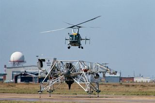 A test flight of the Lunar Landing Training Vehicle (LLTV) ends as astronaut Jim Lovell lands on a runaway at Ellington Air Force Base near Houston. Nicknamed the "flying bedstead," the LLTV allowed astronauts to master the intricacies of landing on the moon by simulating the lunar module's performance. Lovell would later land the Apollo 13 lunar module in the highlands just north of Fra Mauro on the moon.