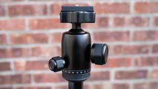 Manfrotto Element MII Aluminium tripod head in front of a brick wall