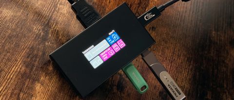 Dockcase Studio Smart USB-C 8-in-1 hub on a desk, showing toucshcreen and case