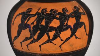 An orange-and-black terracotta pot painted with runners. 