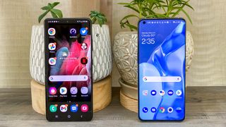 OnePlus 9 Pro and Samsung Galaxy S21 Ultra stood beside each other