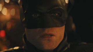 Close-up of Robert Pattinson's face in cowl in The Batman