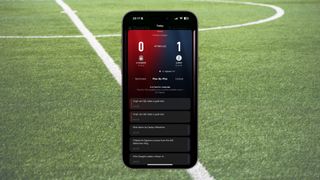 Apple Sports on an iPhone 15 Pro Max frame with a football pitch as background