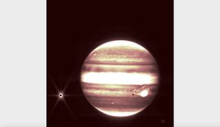 Jupiter and its moon Europa, left, are seen through the James Webb Space Telescope’s NIRCam instrument 2.12 micron filter.