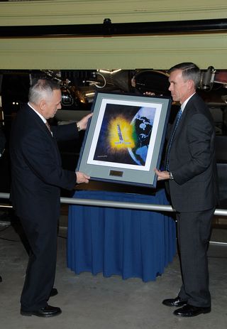 Presentation of a Painting of the Hexagon satellite