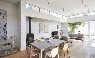 Living area with dinning space and sofa set at Victorian house.