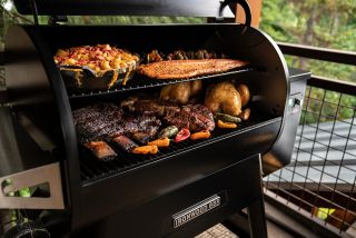 A selection of meats, veg & fish cooking in a Traeger grill