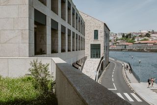 the rebello hotel, view of exterior and road beside river