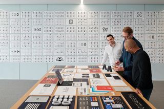 View of Alan Dye and two graphic designers discussing SF and SF Symbols typefaces at Apple Park