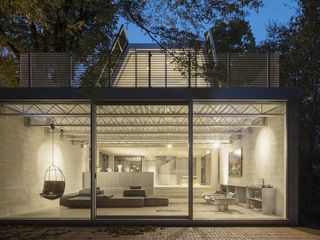 outside looking in at Reciprical House by GianniBotsfordArchitects