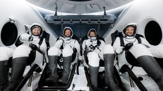 The Polaris Dawn crew of Anna Menon (at left), Scott Poteet, Jared Isaacman and Sarah Gillis seen aboard Dragon "Resilience" after their splashdown and recovery, Sept. 15, 2024. 